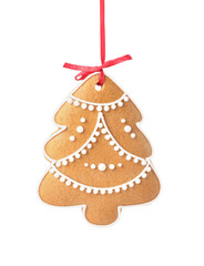 Christmas tree shaped cookie with string isolated on white