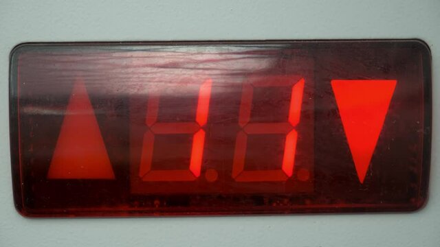 Counting the number of floors on the display of the freight Elevator. Countdown
