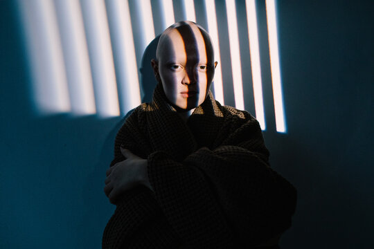 Young hairless model with striped shadows on face