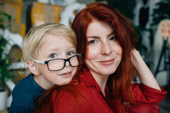 Woman and little son in their home props workshop