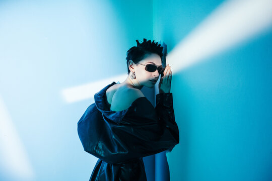 Stylish woman in futuristic outfit