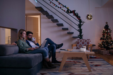 Young Couple Watching Movie On Tablet