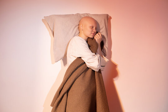 Sleeping hairless model with pillow and plaid
