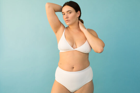 Sensual overweight female touching hair