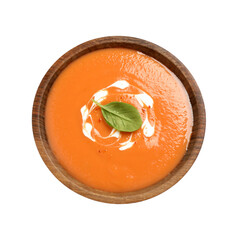 Tasty creamy pumpkin soup with basil in bowl on white background, top view