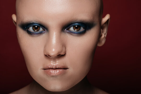 Bald model with unusual makeup