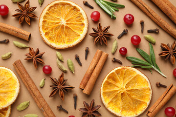 Different mulled wine ingredients on brown background, flat lay