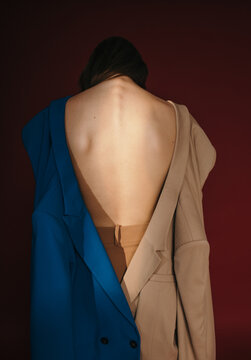 Unrecognizable model in different jackets on naked back