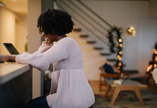 Beautiful african american girl making video call, christmas time