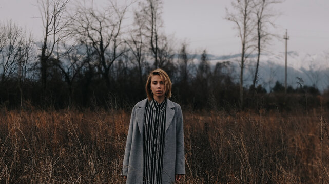 A beautiful portrait of a young blond woman in the field