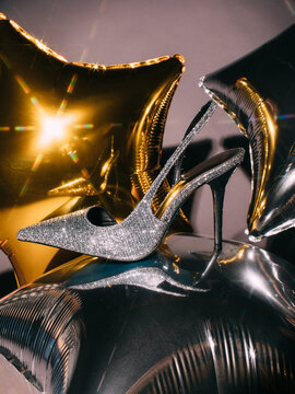 Trendy shoes on balloons during party