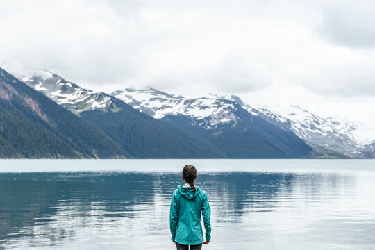 Female taking in view at Joffre lake in Vancouver, BC