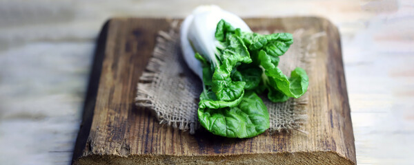 Raw bok choy cabbage on a wooden surface. Healthy food.