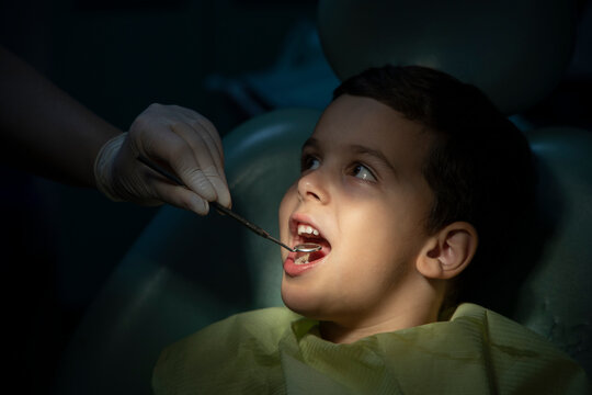 Dentist Working On Child Teeth