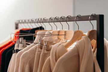 Rack with trendy clothes in store
