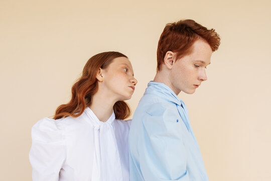 Androgynous couple in retro blouses