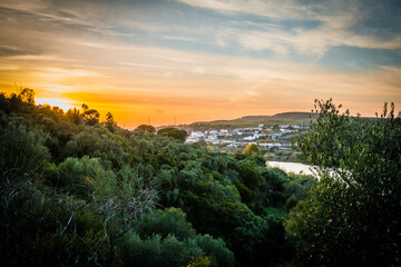 Autumn sunset in the hills over the river. River Tagus in Portugal
