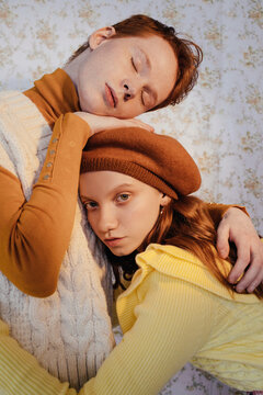 Young ginger models in knitted clothes