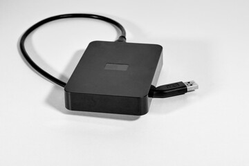 Black external hard drive isolate on a white background.