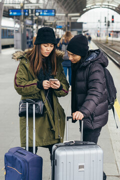 Asian couple waiting for a train on train station