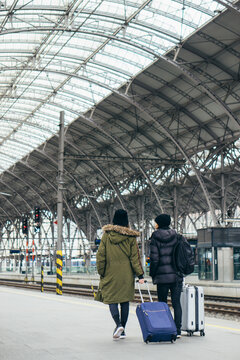 Asian couple on a train station