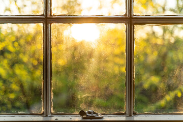 Sunlight shining through an old window