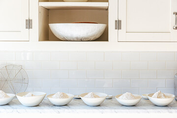 Bowls of flour prepared for sourdough bread baking workshop