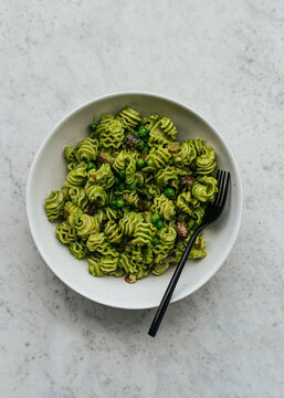 Vegetarian pesto pasta in ceramic bowl