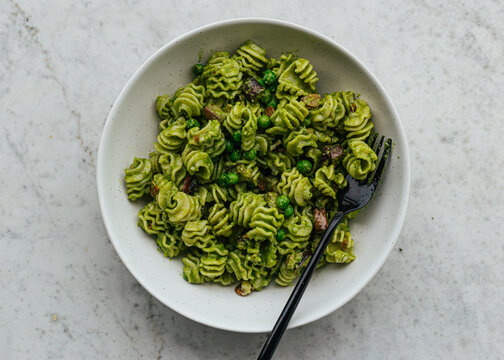 Vegetarian pesto pasta in ceramic bowl