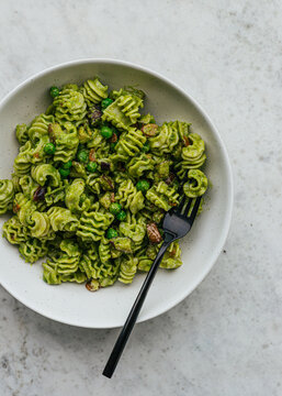 Vegetarian pesto pasta in ceramic bowl