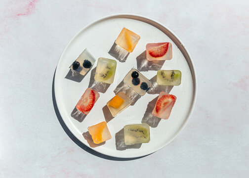 Japanese fruit jellies with fresh fruit on ceramic plate