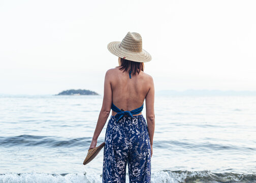 Female In Summer Apparel By The Beach