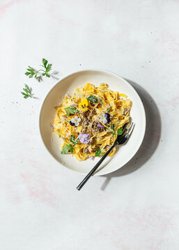 Homemade pasta with edible flowers