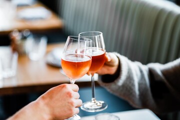 person holding a glass of wine