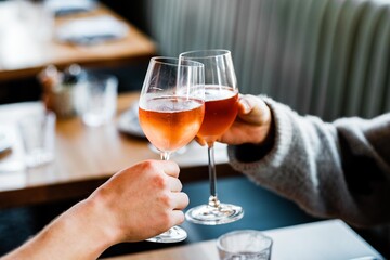 person holding a glass of wine
