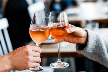 person holding a glass of wine