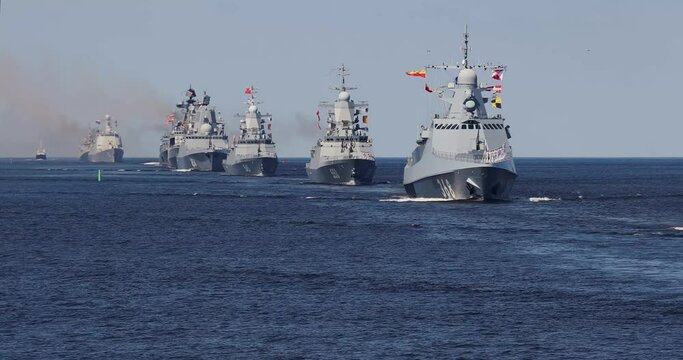 A line ahead of modern russian military naval battleships warships in the row, northern fleet and baltic sea fleet, summer sunny day, 4k footage video
