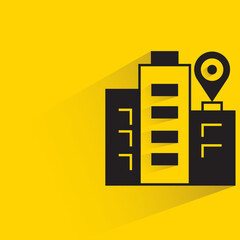 office building and map pin with drop shadow on yellow background