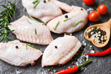 Raw chicken wings, herbs and spices with pepper chili tomato garlic for cooking thai asian food rosemary chicken