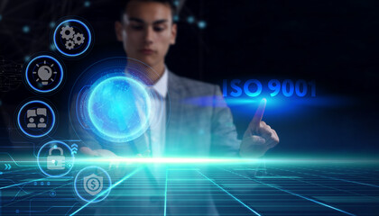 Business, technology, internet and network concept. Young businessman thinks over the steps for successful growth: ISO 9001
