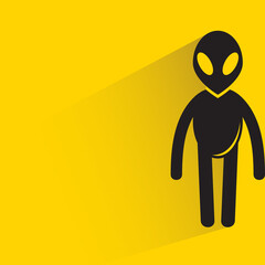 alien with drop shadow on yellow background