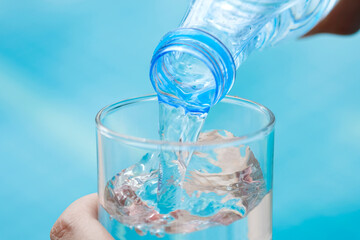 Clean water for good health.  Pouring Fresh Pure Water From Pitcher Into A Glass. 
Health And Diet Concept. Lifestyle Healthcare And Beauty. 