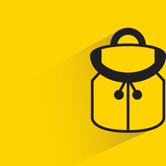 backpack with drop shadow on yellow background