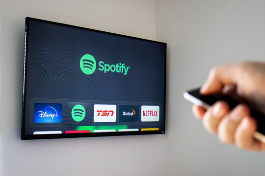 Calgary Alberta, Canada. Feb 26 2020. A person using the Spotify application on a Apple TV box