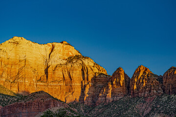 The sunrise lights up the cliffs of the Zion Valley