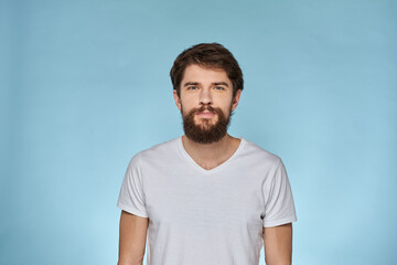 man in white t-shirt gesturing with his hands studio cropped