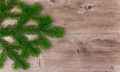 green Christmas tree on a wooden vintage background. selective focus. xmas background. copy space.