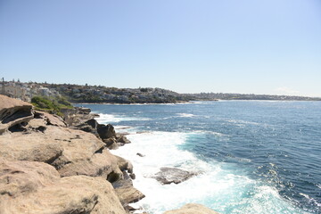 Fototapeta na wymiar Australian waves with the blue water and was on the sunny day in Sydney, Australia