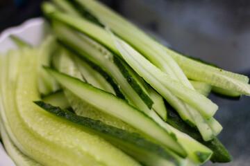cucumber cut into strips for making sushi. homemade sushi