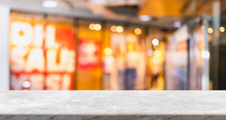 Empty white marble stone table top and blur glass window interior shopping mall banner mock up abstract background - can used for display or montage your products.